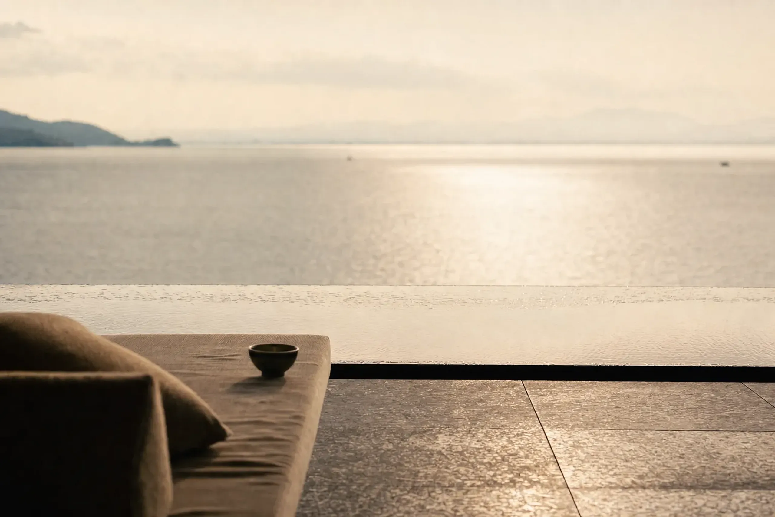 the Infinity Lounge at The Main on Mount Uchimi, its horizontal terrace lines merging with the flat surface of Lake Biwa