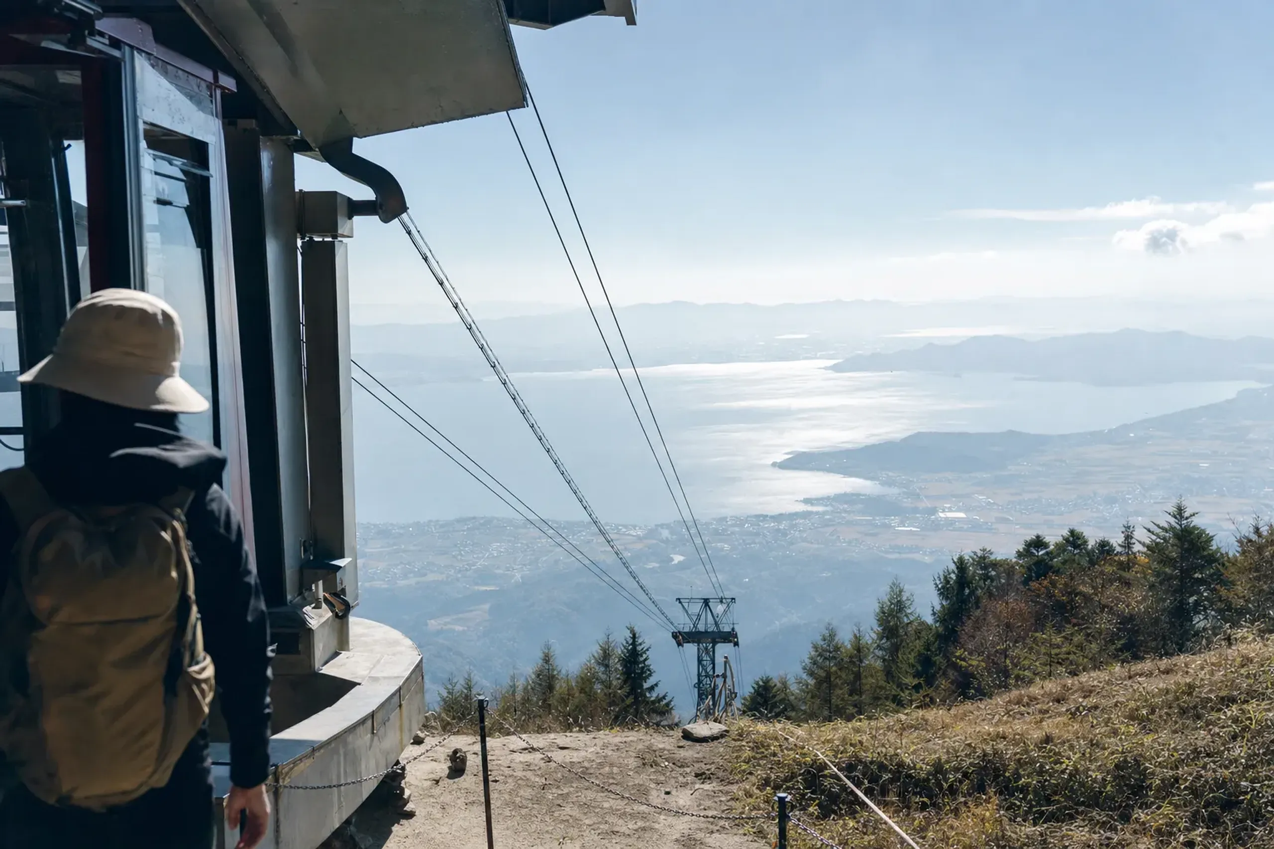 the Biwako Valley summit ropeway station at 1,108m on Mount Uchimi, with the connecting green chairlifts rising toward Mount Hōrai