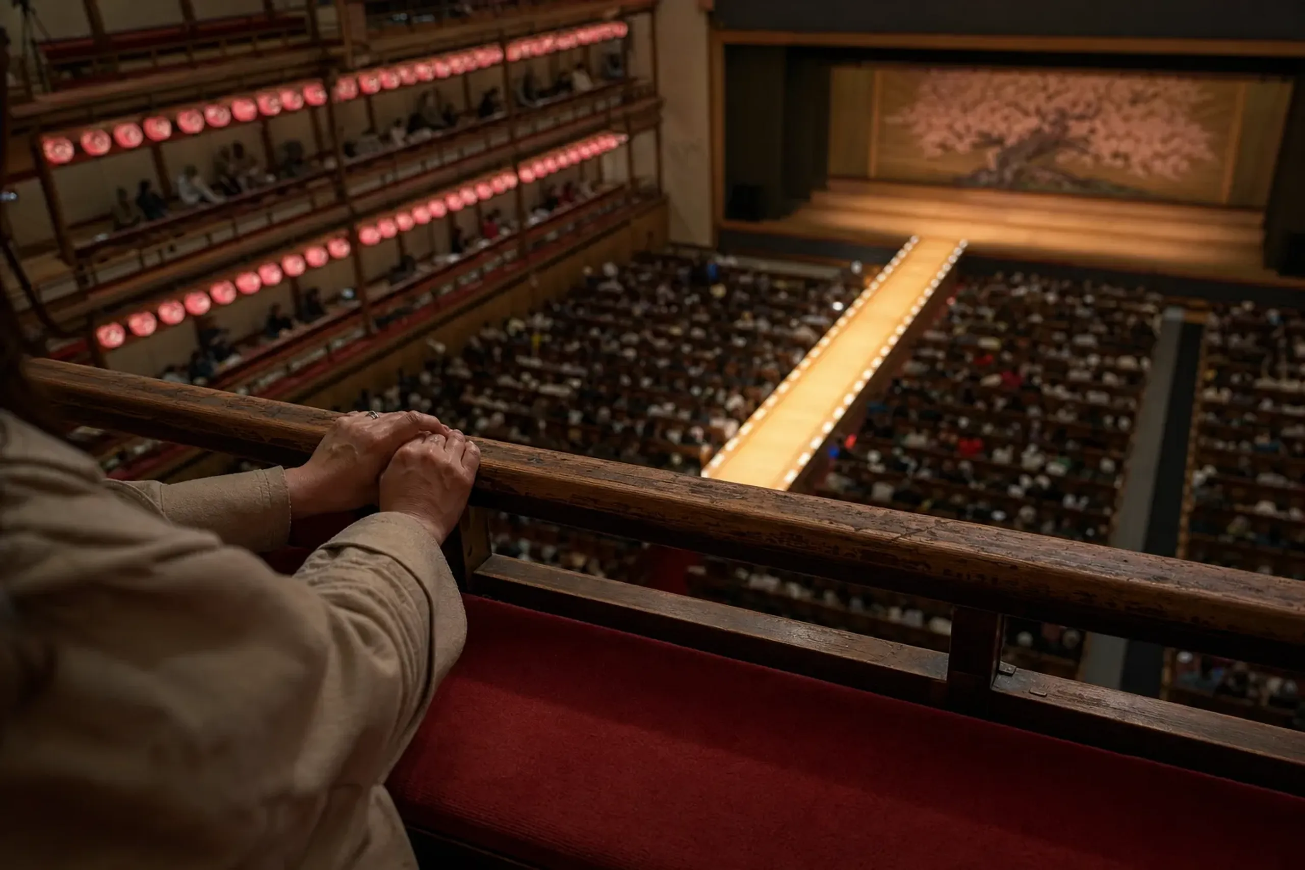 The single-act 4th-floor seating gallery (hitomaku-mi seki) of Kabuki-za overlooking the illuminated hanamichi runway and stage