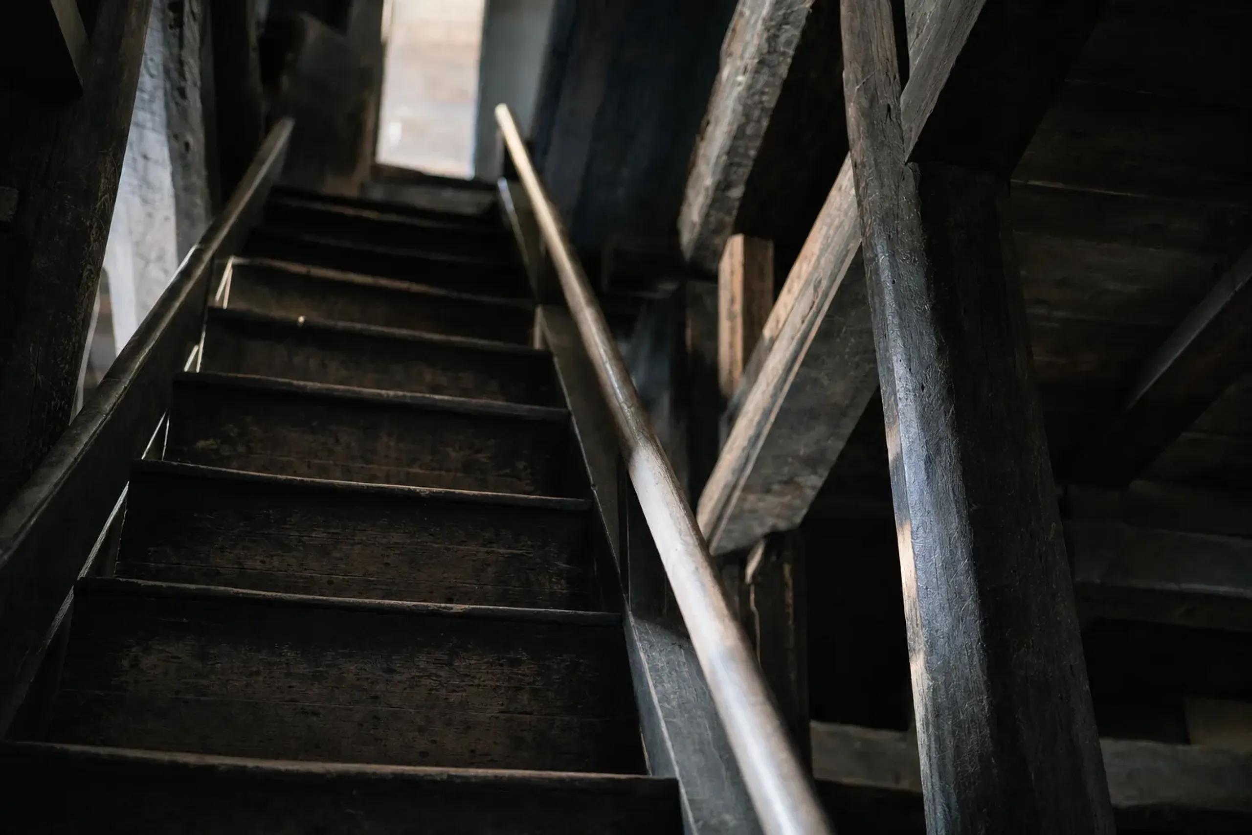 the steep narrow interior staircase connecting the five floors of the Matsue Castle keep