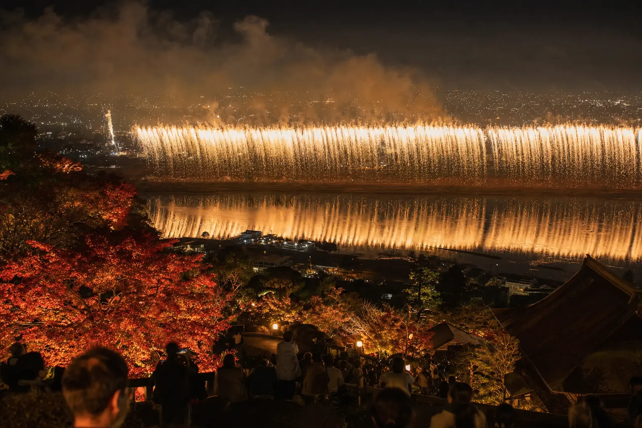 the wide Phoenix star-mine fireworks stretching two kilometres across the Shinano River water at Nagaoka