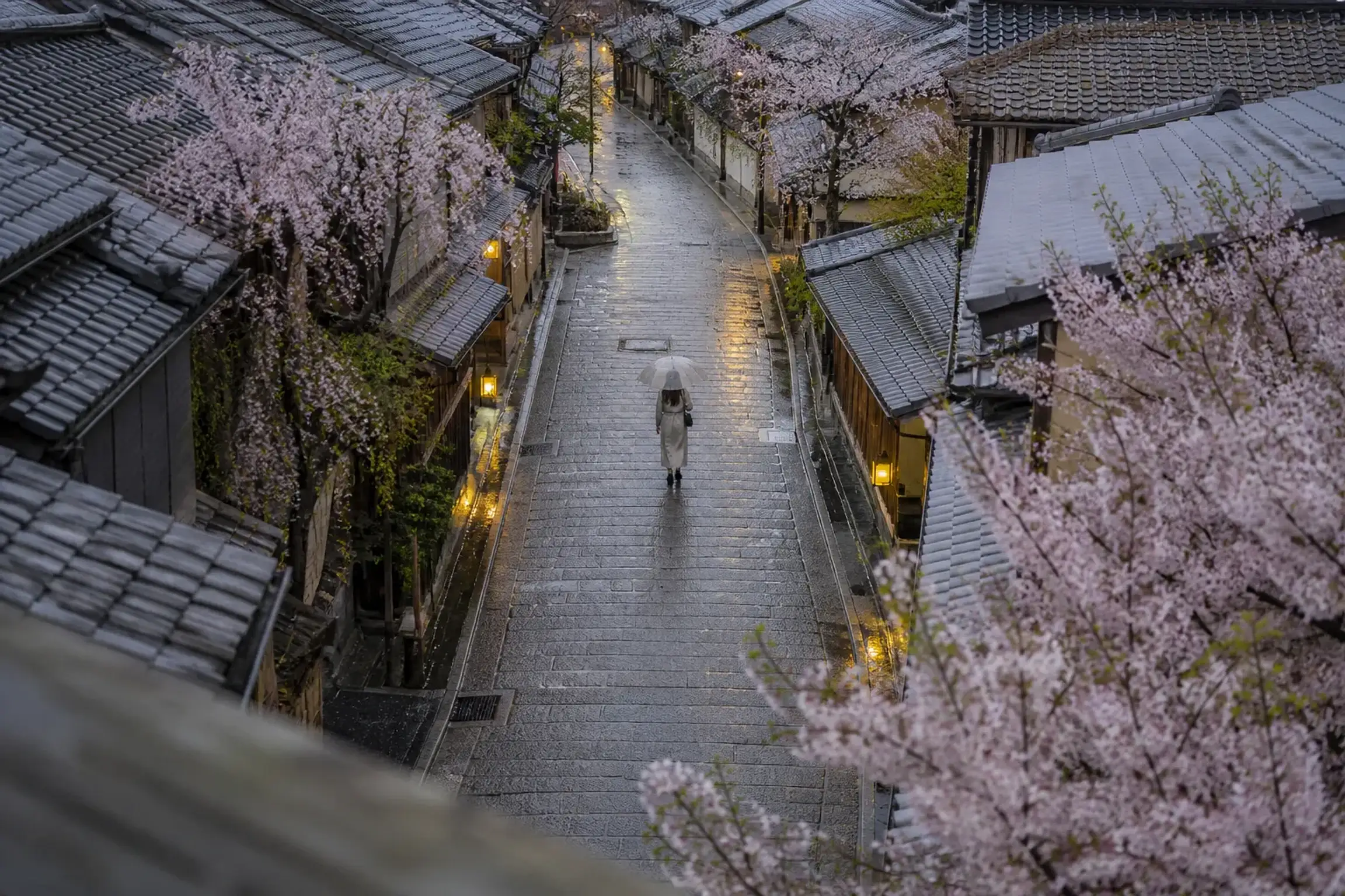 Atmospheric traditional Kyoto lane at dusk, illustrating why some travelers should sleep in Kyoto