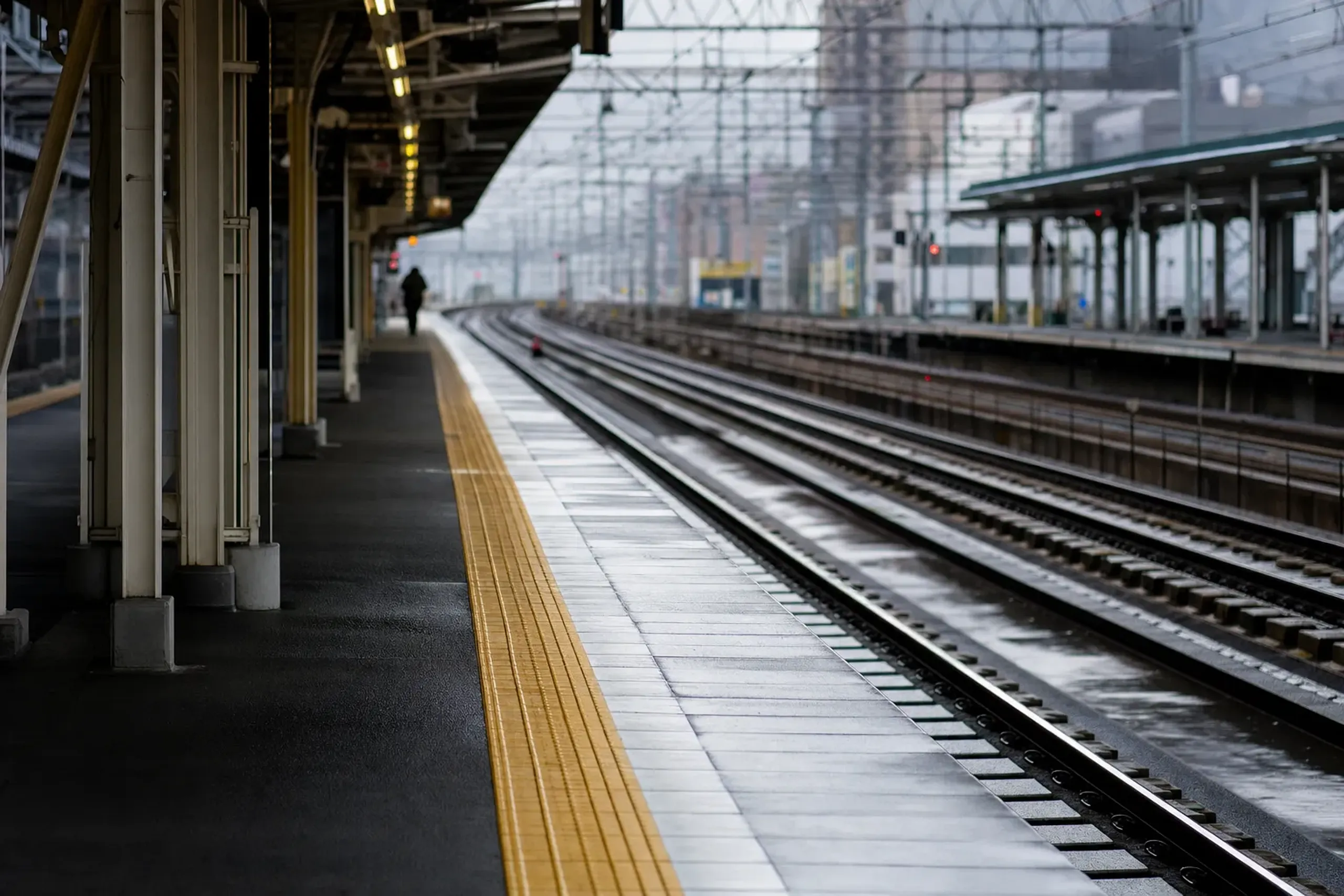 the platform and tracks of Hakata Station in Fukuoka, departure point for the drive to Sasaguri