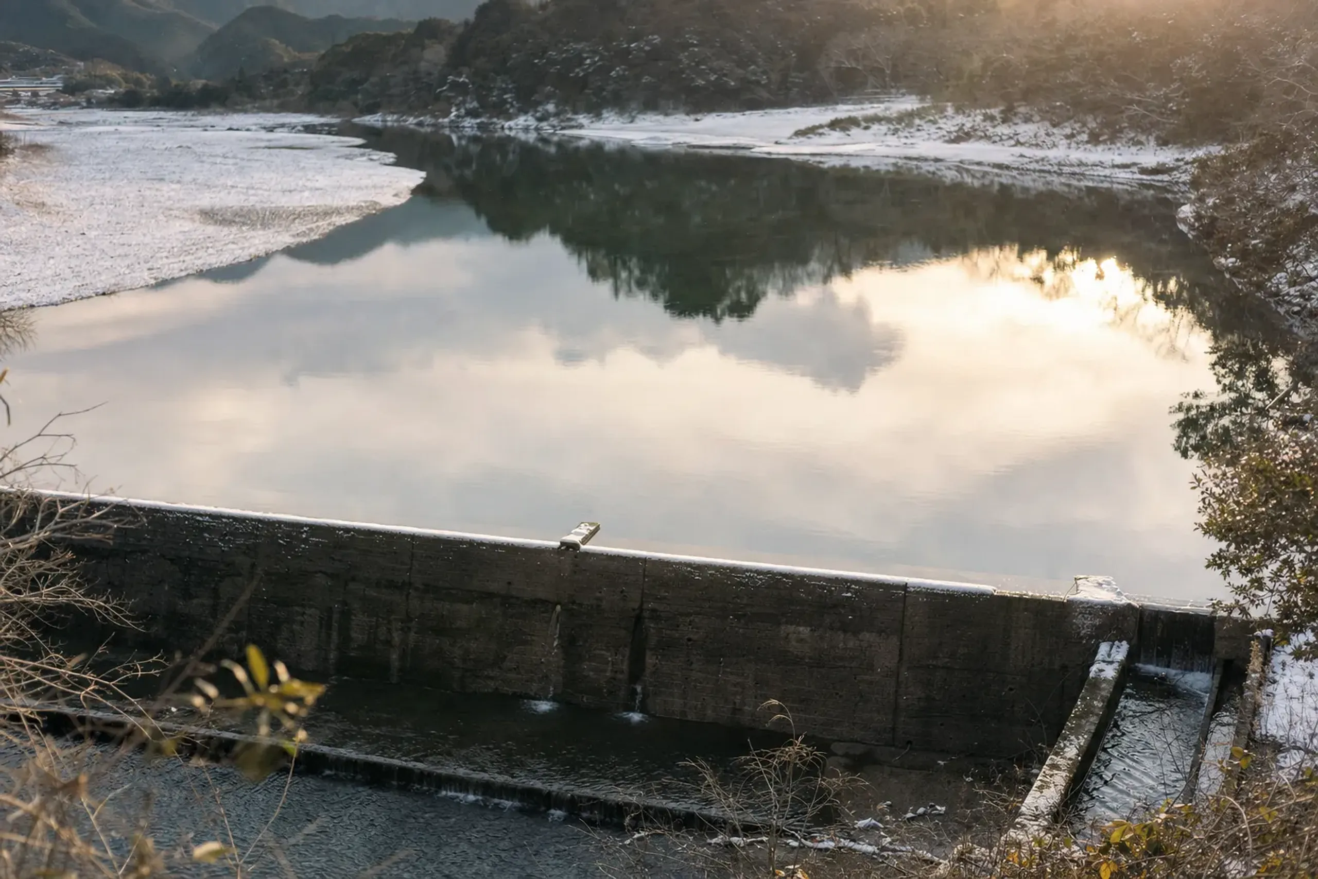 The 1937 Saga weir on the Shimanto River's main stream, its low concrete barrier diverting water toward a hydroelectric intake in western Kōchi