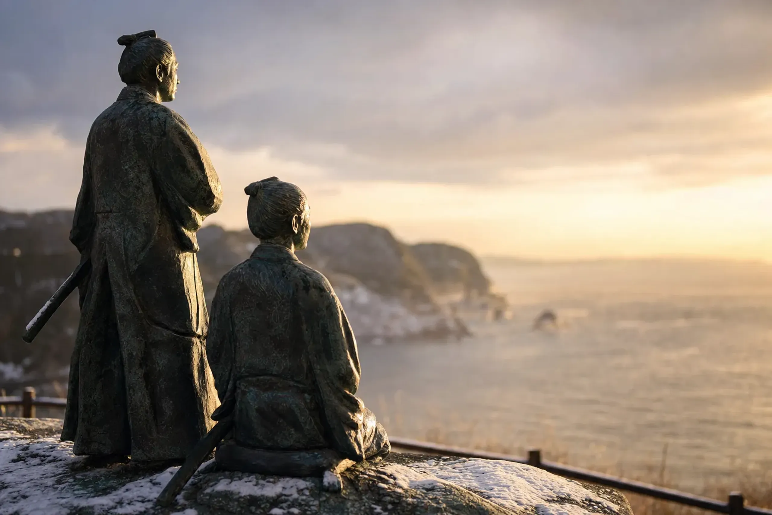 The bronze statues of Yoshida Shōin and his student Kaneko Shigesuke at Benten Island, facing outward across Shimoda Bay