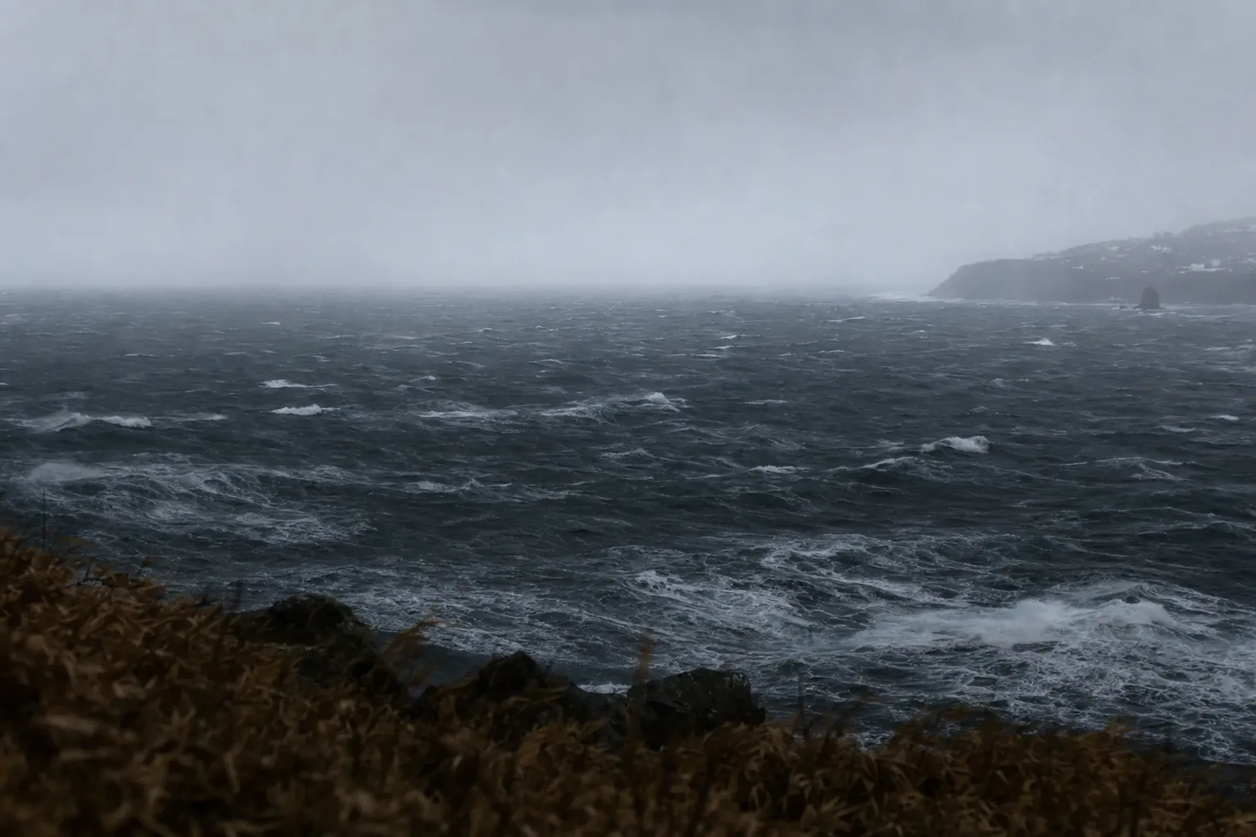 storm-tossed, severely weather-exposed dark waters of the Nemuro Strait off the Shiretoko Peninsula