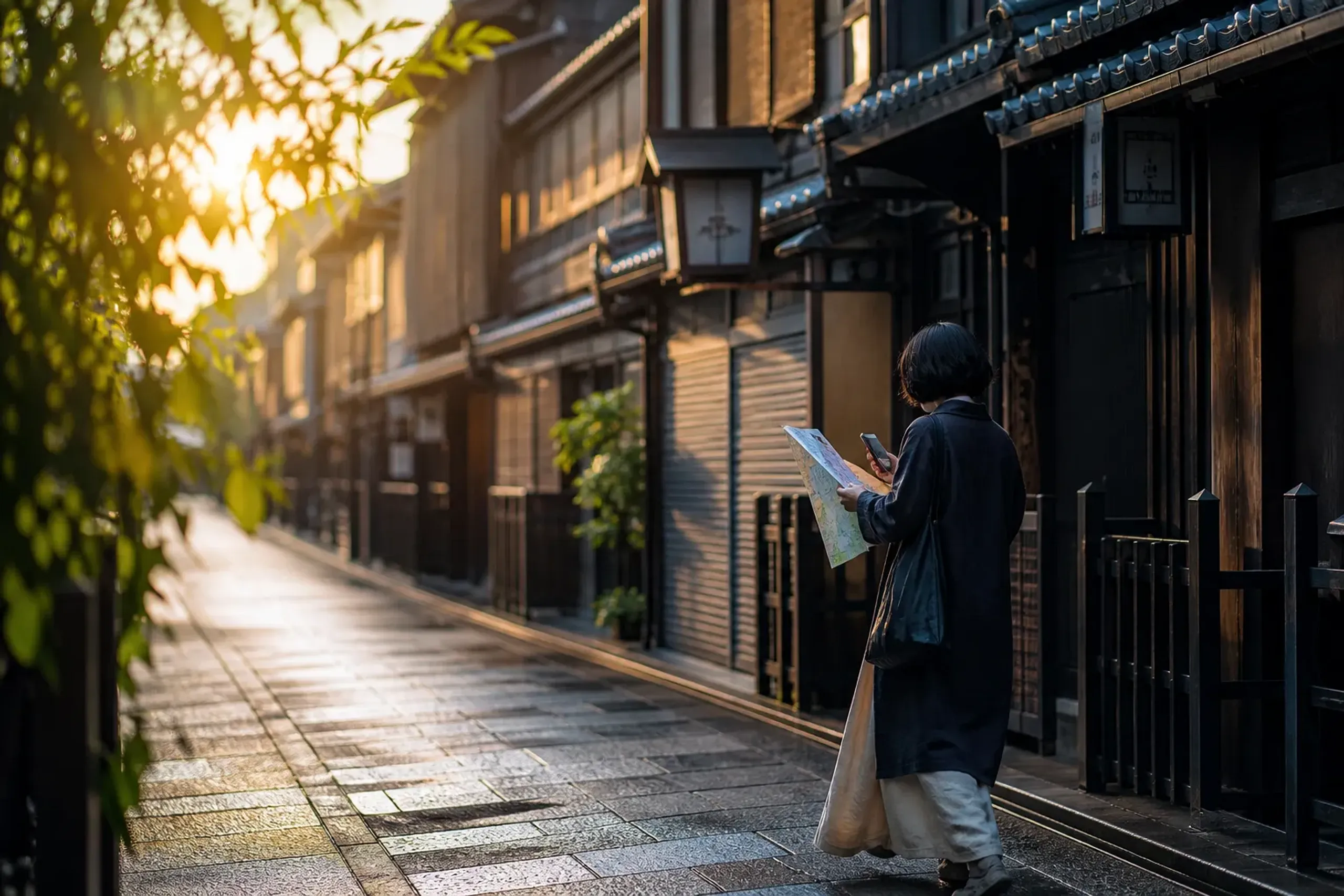 Traveler planning an early-morning Kyoto route on a quiet side street