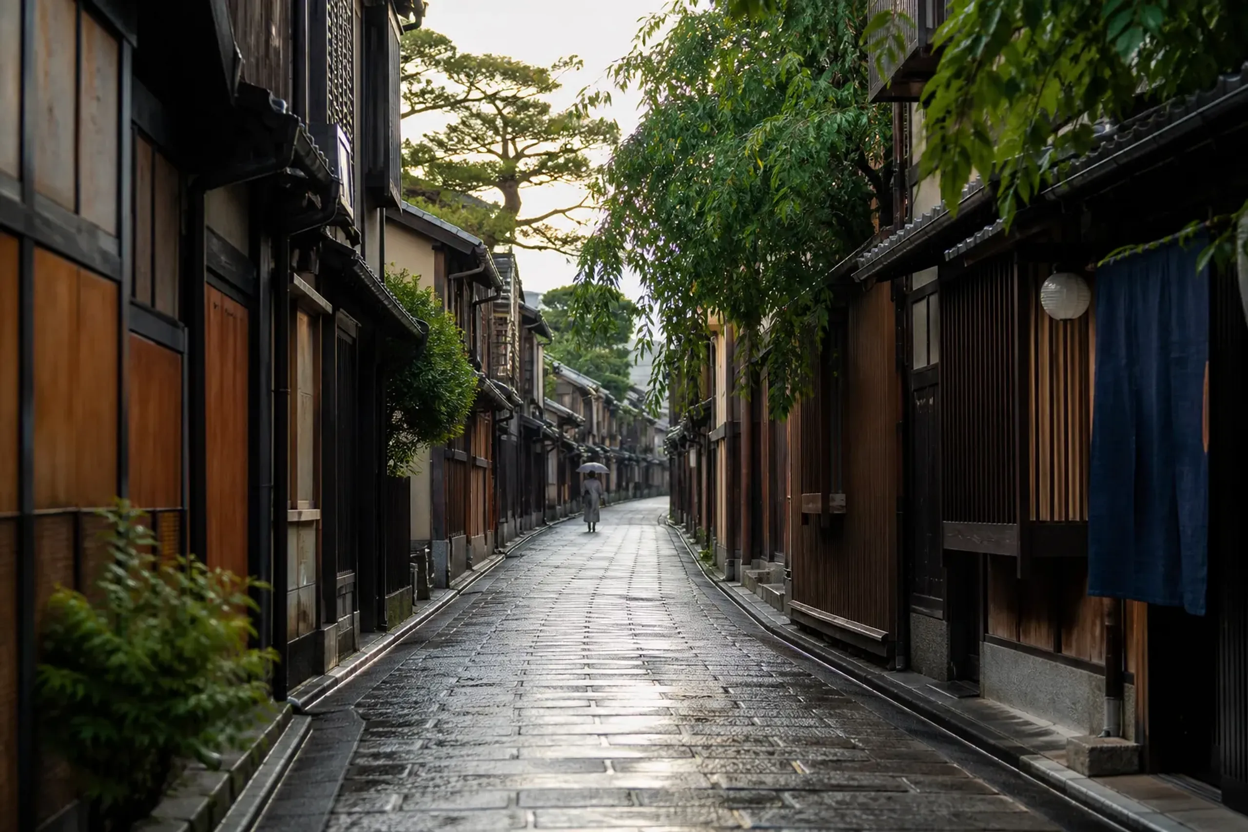 A calm residential lane of wooden machiya houses in Kyoto away from crowds