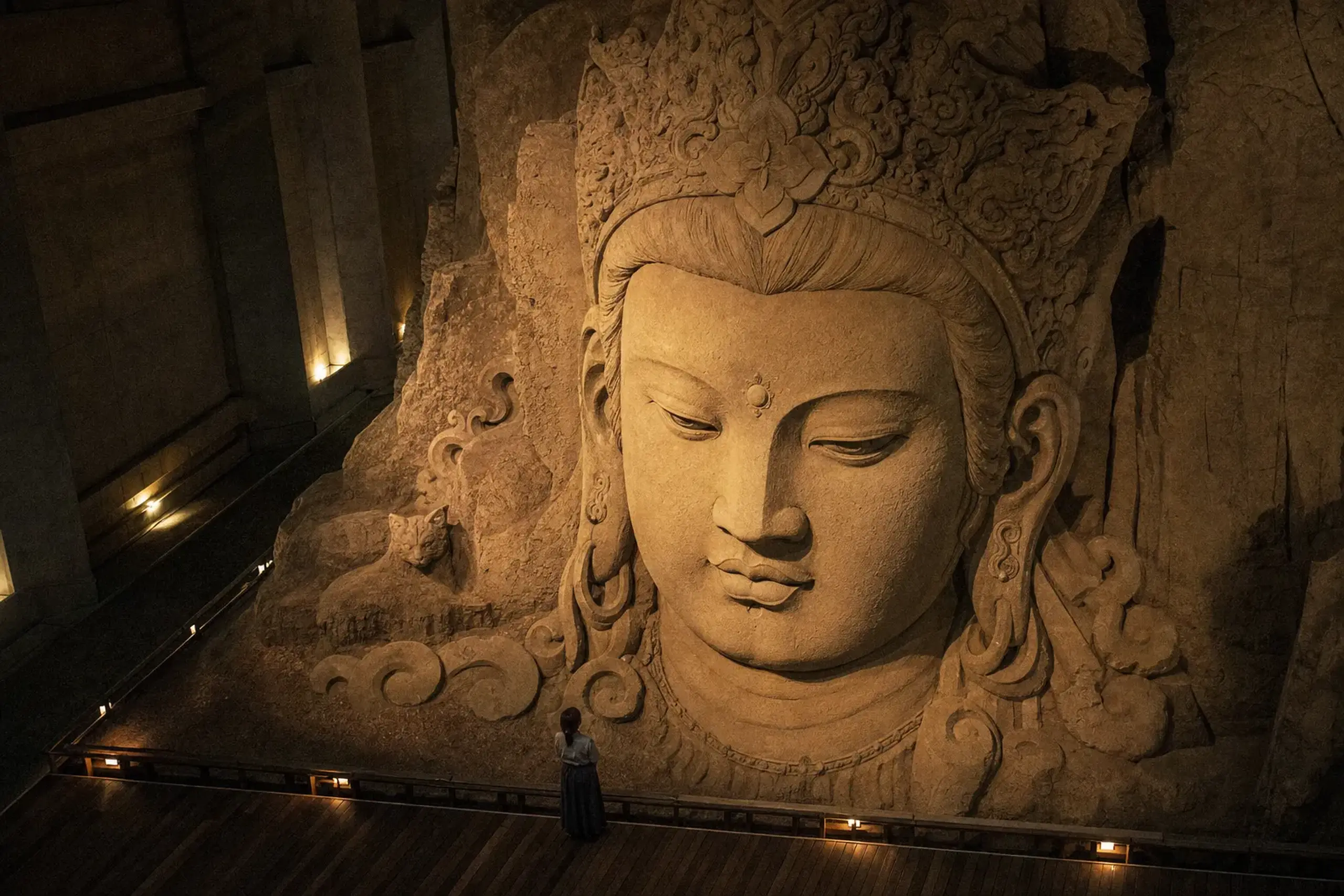 A full-scale sand sculpture inside the Sand Museum in Tottori, its surfaces cut as sharply as carved stone