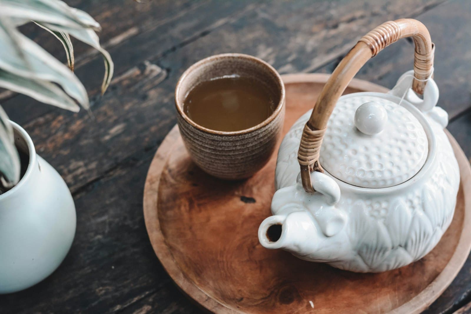 Japanese teapot and cup on a wooden tray