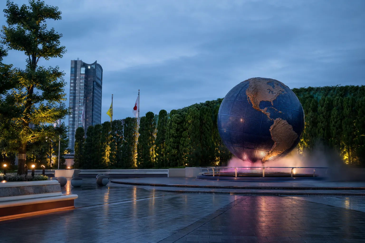 The Universal Studios Japan globe landmark at the Osaka park entrance during golden hour