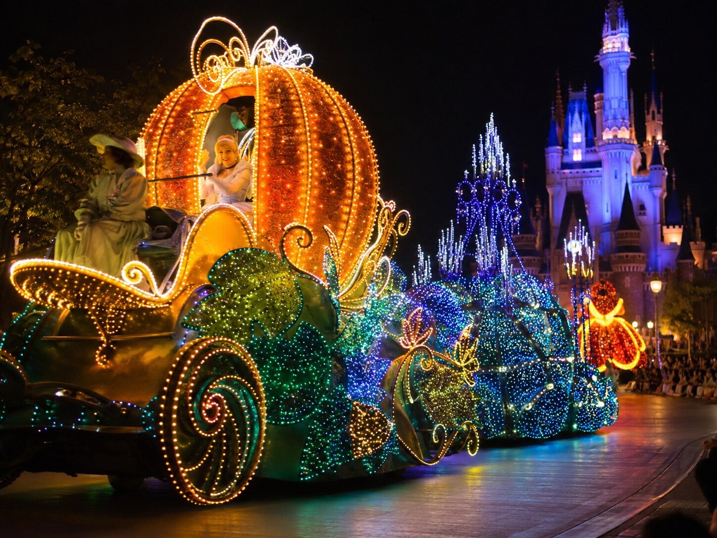 Colorful glowing floats passing by during the Tokyo Disneyland Electrical Parade Dreamlights.