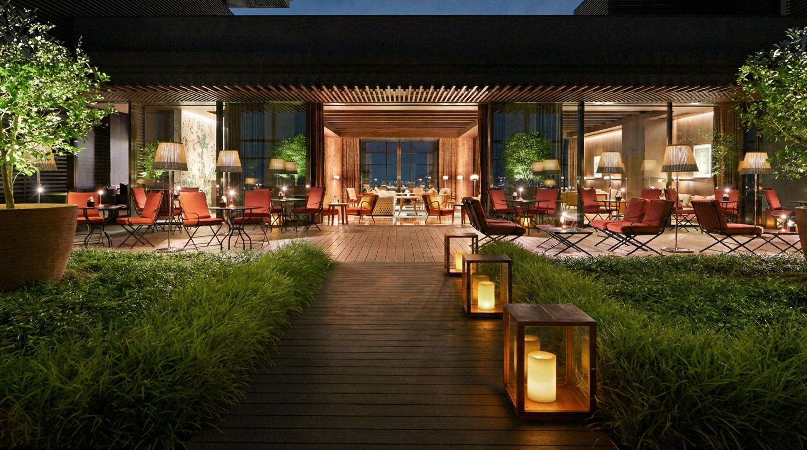 Outdoor terrace at The Bvlgari Bar Tokyo with citrus trees and city views.