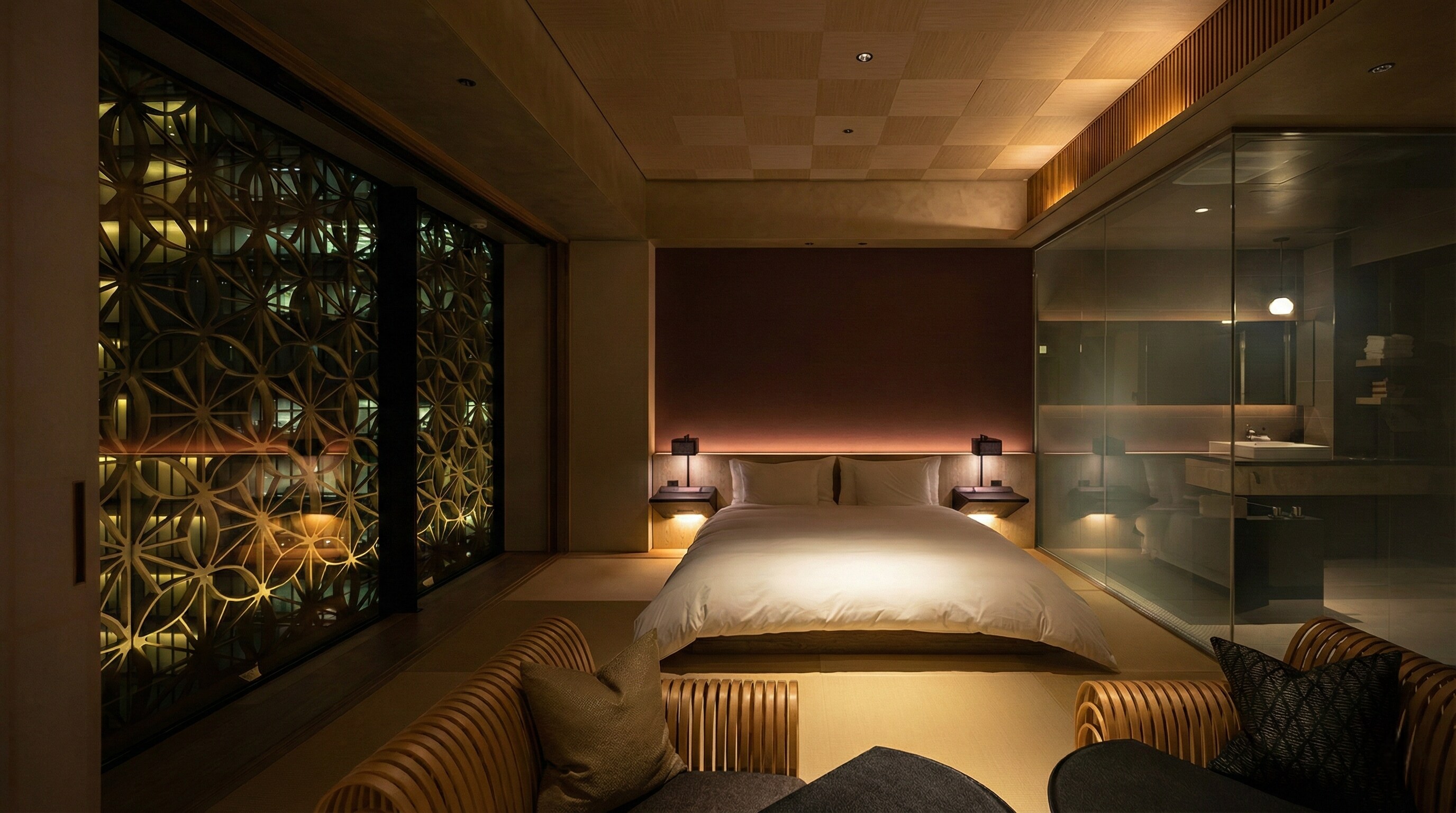 A luxury guest room at Hoshinoya Tokyo featuring shoji screens and tatami floors.