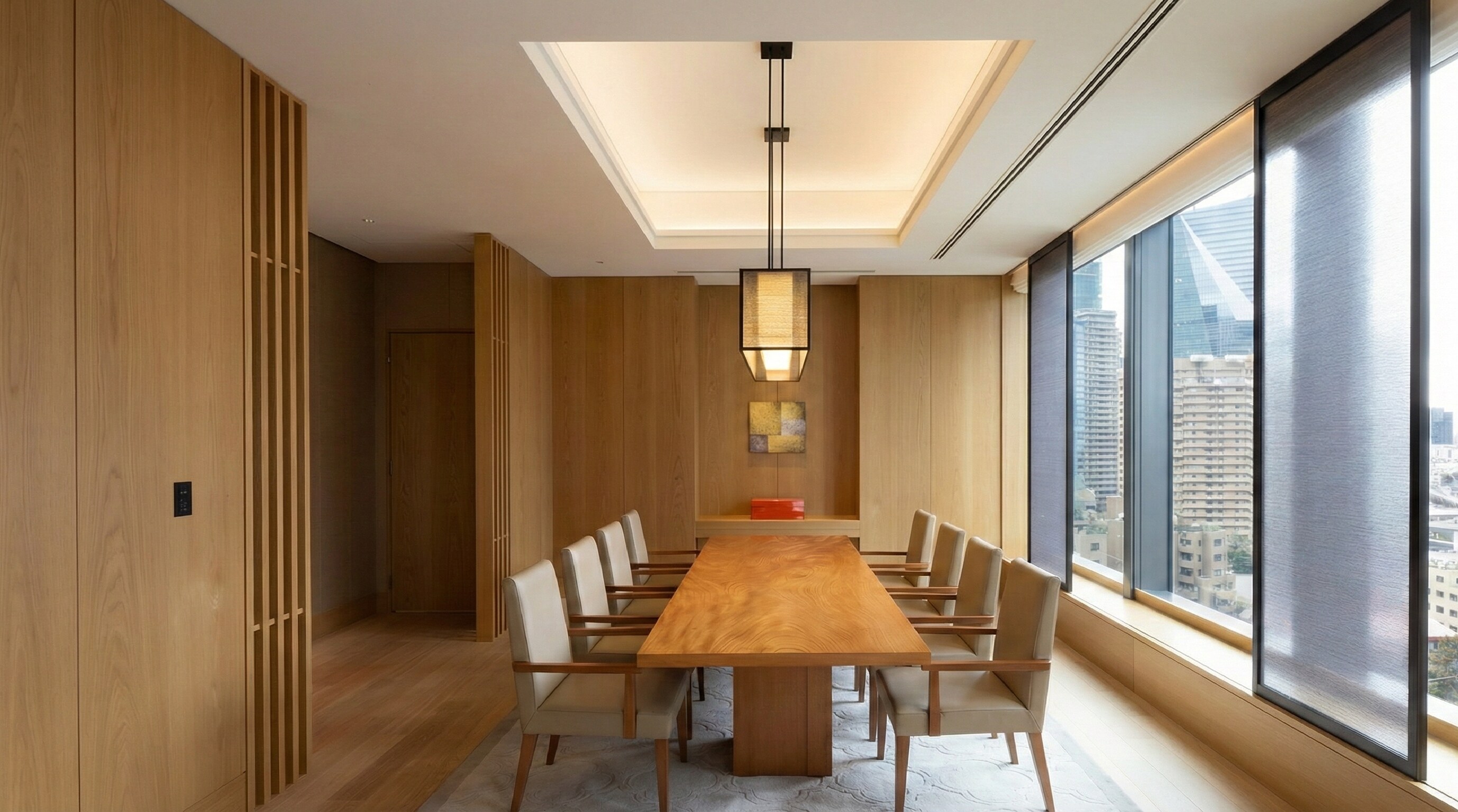 An elegant dining table set for dinner within the Presidential Suite, featuring Japanese tableware.