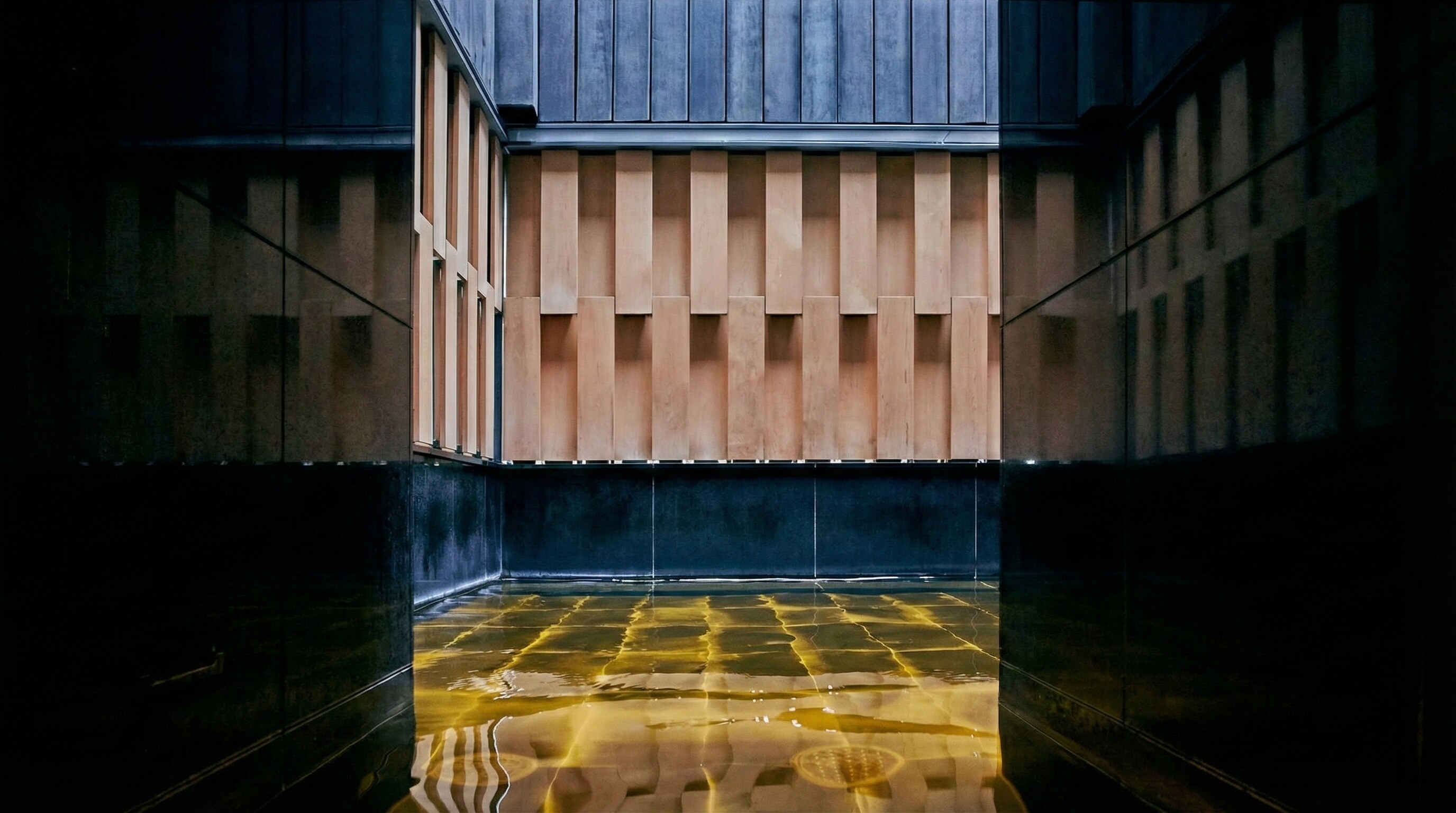 The open-air rooftop hot spring bath at Hoshinoya Tokyo.