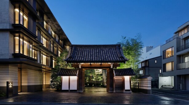 The majestic, historic wooden Kajiimiya Gate at the entrance of Hotel The Mitsui Kyoto.
