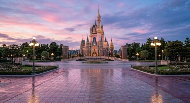 Cinderella Castle at Tokyo Disneyland during a peaceful twilight evening.
