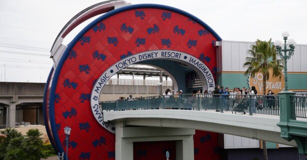 Capture of the Tokyo Disney Resort entrance featuring the Bon Voyage Store and pedestrian bridge. — Photo by Dmitry Romanoff on Pexels