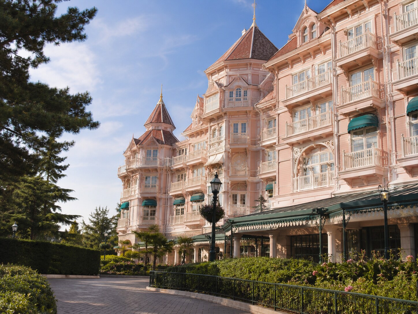 Elegant Fantasy Springs luxury hotel exterior with landscaped gardens.