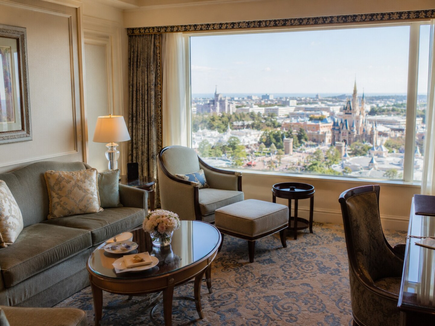 Elegant living room of a qualifying luxury suite at a Tokyo Disney Resort hotel overlooking the theme parks.