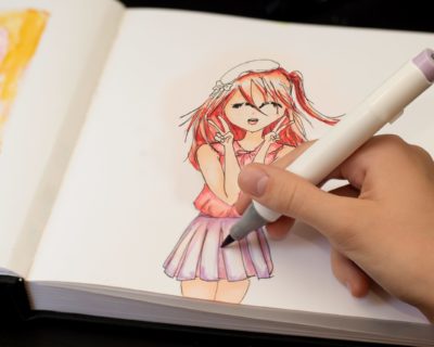 girl-s-hand-drawing-anime-manga-sketch-with-alcoho-2022-11-15-14-03-55-utc